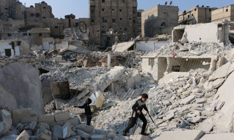 Syrian boys play in the rubble of Aleppo.