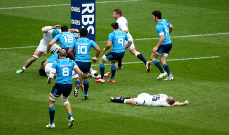Mike Brown lies injured on the pitch