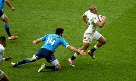 Jonathan Joseph of England breaks away to score the second England try.