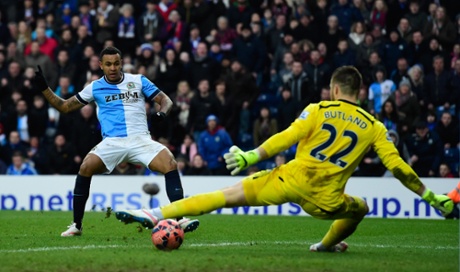 Jack Butland is nutmegged by Joshua King for Blackburn's third.