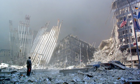 A man stands amid the rubble of the World Trade Centre.