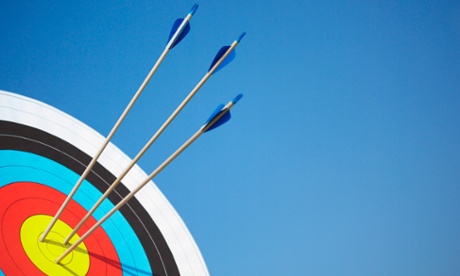 Archery target with arrows in the bull's eye