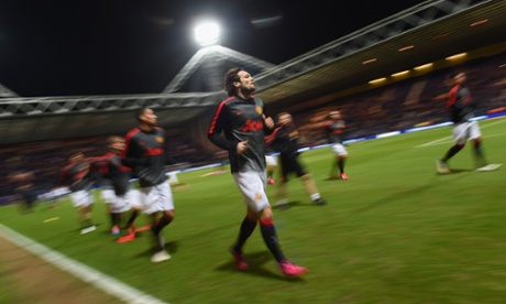 Daley Blind warms up with his teammates at Deepdale.