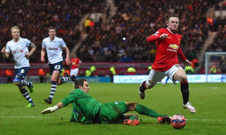 Wayne Rooney draws a foul from Thorsten Stuckmann to win a penalty.