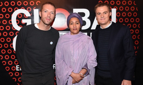 Coldplay frontman Chris Martin, left, UN Secretary-General's Special Adviser on Post-2015 Development Planning, Amina J Mohammed, center, and CEO of The Global Poverty Project Hugh Evans, pose together at the Global Citizen 2015 media luncheon at Locanda Verde