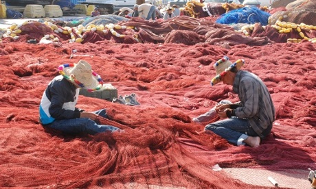 Moroccan fishmen restore their nets