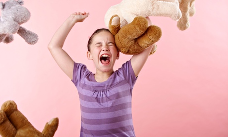 Girl throwing teddy bears