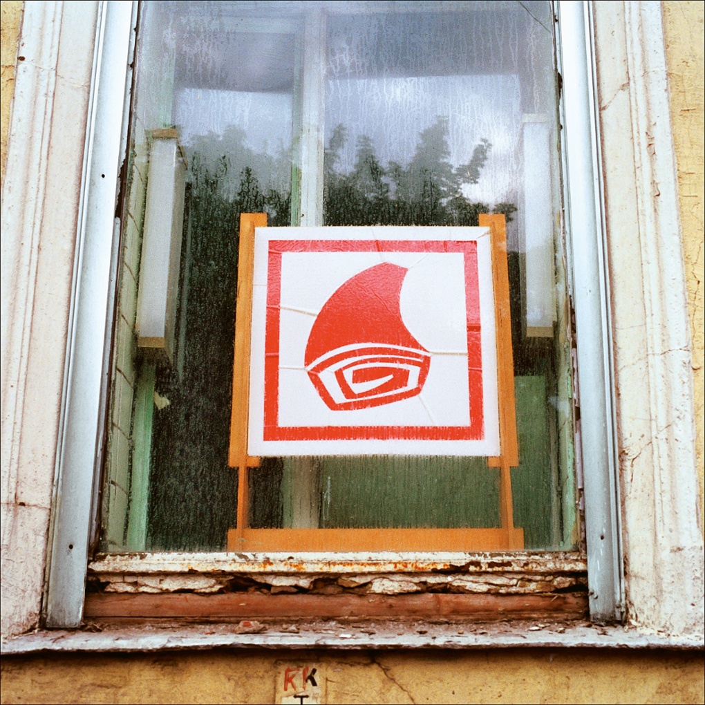 The crumbling window of a butcher's shop in Moscow, pictured in 1990