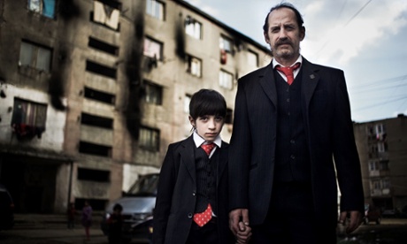 The Romanians Are Coming: Sandu and his son Antonio outside their Romanian home.