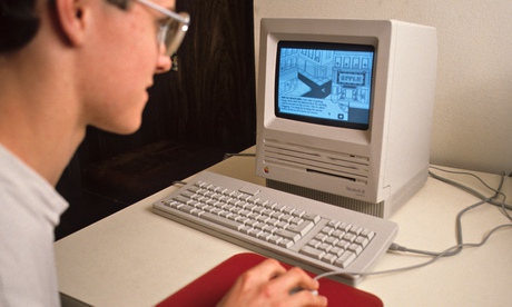 Teenager at play on an early Macintosh: data stored using proprietary software can be extremely diff