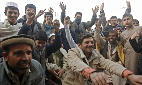 Afghan fans watch the live broadcast of the Cricket World Cup match against Bangladesh at a roadside stall in Kabul. Photograph: Omar Sobhani/Reuters