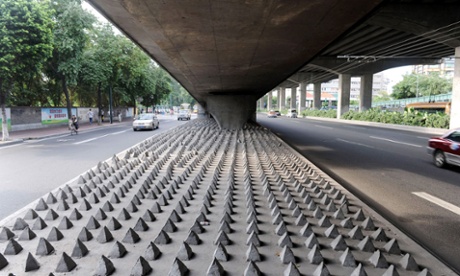 Concrete spikes under a road bridge in Guangzhou city, Guangdong, China.