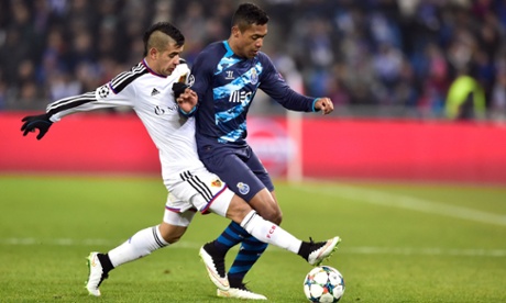 Basel's Derlis Gonzalez attempts to dispossess Porto defender Alex Sandro.