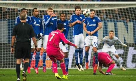 Cristiano Ronaldo pings a free-kick over the Schalke wall.