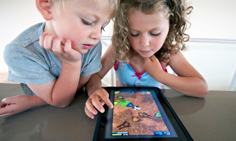 Children playing computer game on an iPad