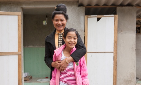 Lo Thi Trang, 12 and her mother, Lo Thi Dinh, in front of their new hygienic latrine in VietNam.