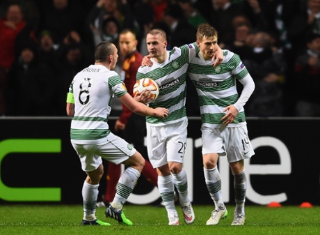 Stuart Armstrong, right, celebrates with team mates Scott Brown and Leigh Griffiths after getting Celtic back into the game.