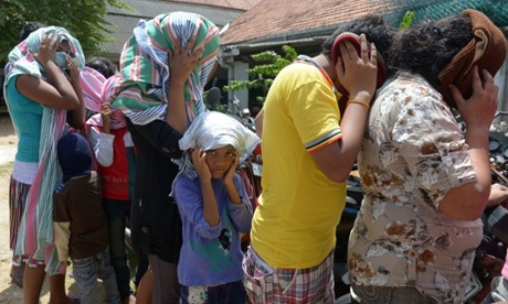 Sri Lankan asylum seekers sent back by Australia prepare to enter the magistrates court in Galle.