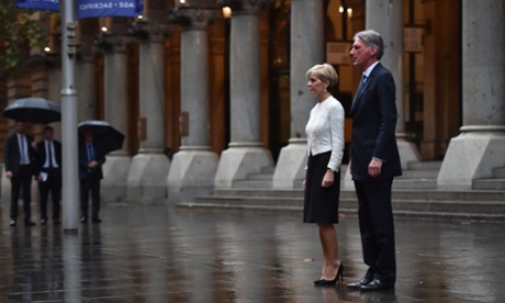 British foreign secretary Philip Hammond and Australian Foreign Minister Julie Bishop pay their respects to Australian soldiers after laying a wreath at the war memorial in Sydney.