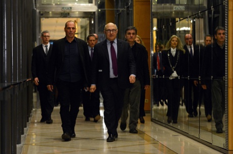 Greek finance minister Yanis Varoufakis and his French counterpart Michel Sapin arrive at a press conference following their meeting at the French Finance Ministry on Sunday.