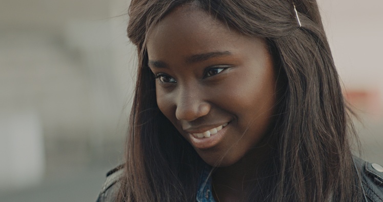French Film First film release: Young girl smiles in Girlhood film still