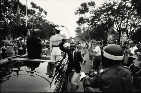 HUMAN RIGHTS HUMAN WRONGS  Leopoldville [Young man steals the sword of King Baudouin I, during procession with newly appointed President Kasavubu], Leopoldville, Republic of the Congo (now Democratic Republic of the Congo), June 30 1960, by Robert Lebeck