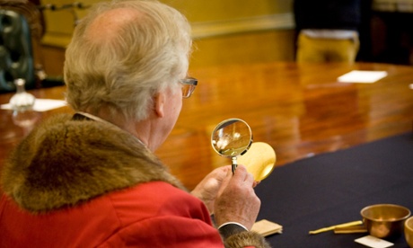 Jury members examine coins at the Trial of the Pyx