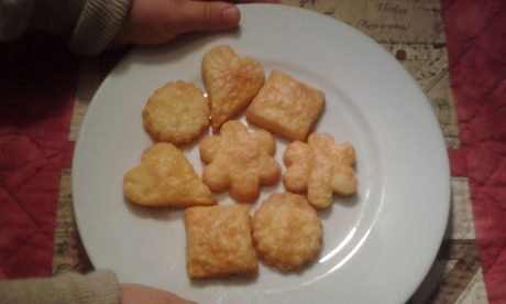 Rosemary's daughter Miranda with Aunt Edie's cheese biscuits, freshly baked.