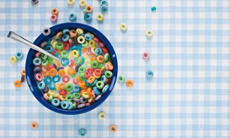 Bowl of cereal with milk and cereal on tablecloth