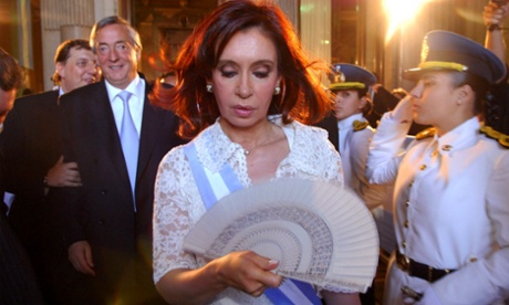 Fernandez walks in front of her husband, outgoing President Nestor Kirchner after her inauguration ceremony.