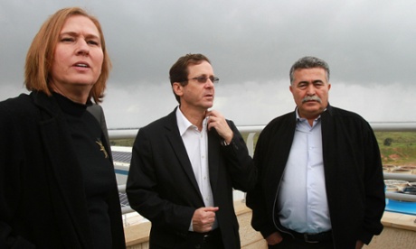 Former justice minister and Hatnuah party leader Tzipi Livni, Labour party leader Isaac Herzog and former defence minister Amir Peretz look out over the Gaza Strip from the Israeli border.
