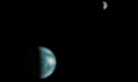 The first photograph of Earth and the Moon from another planet, taken by a Nasa Mars mission in 2003