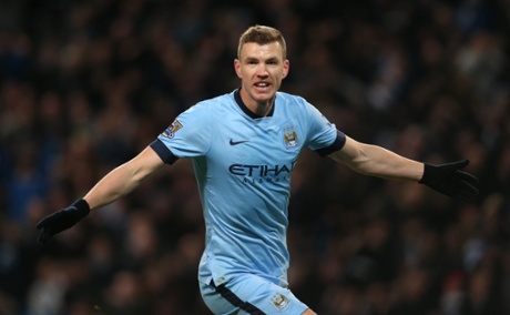 Edin Dzeko celebrates after scoring the third.