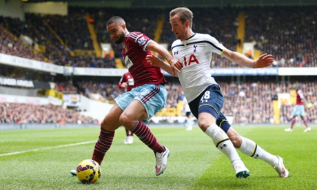 Winston Reid shields the ball from Harry Kane.