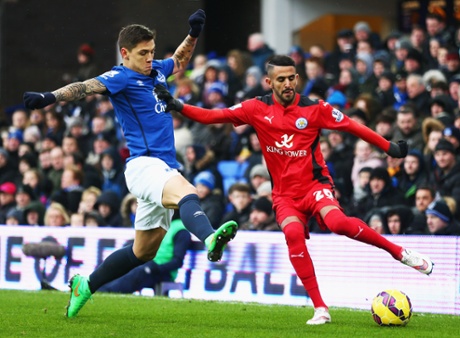 Riyad Mahrez crosses one in whilst holding off the challenge by Muhamed Besic.