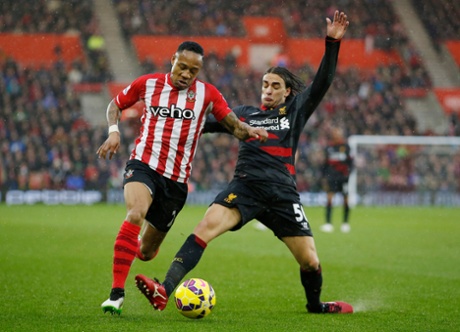 Lazar Markovic tackles Nathaniel Clyne.
