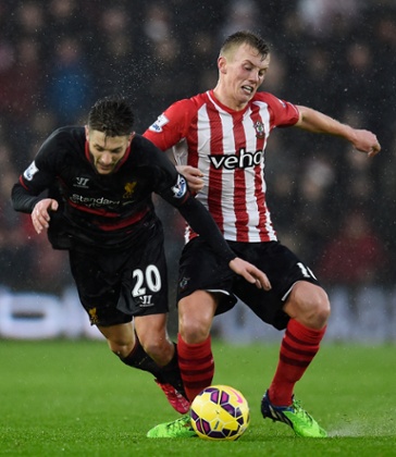 James Ward Prowse barges Adam Lallana.