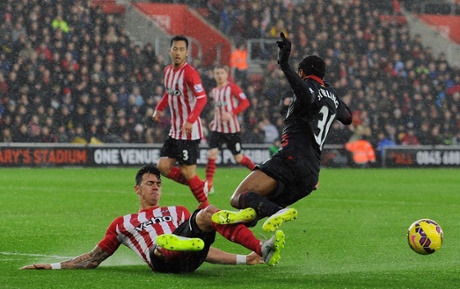Raheem Sterling is brought down by Jose Fonte.