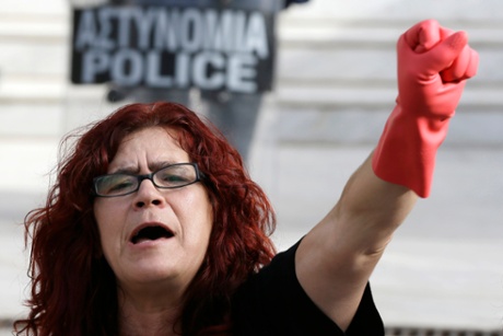 A laid-off finance ministry cleaning staff member outside the supreme court in Athens