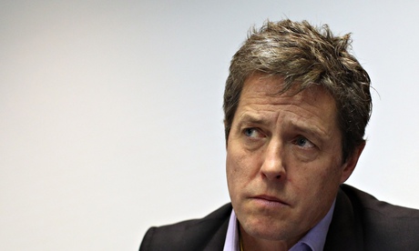 Actor Hugh Grant on the platform at a Hacked Off! meeting. Photograph: Dan Kitwood/Getty Images