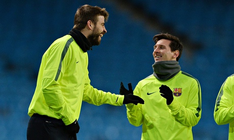 Barcelona's Lionel Messi and Gerard Piqué