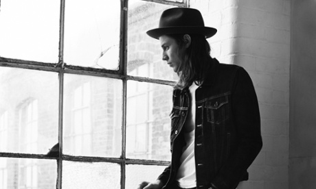 James Bay at a window looking out