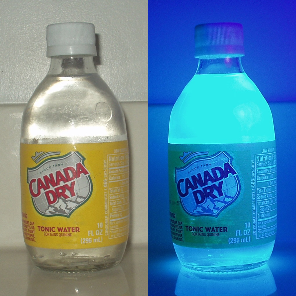Bottle of tonic water shown here under regular light and UV light, which shows the fluorescence of quinine. 