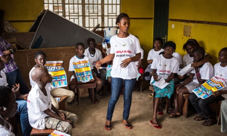 charity worker teaches Ebola prevention
