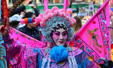 a man wearing ornate dress for a chinese new year celebration in london