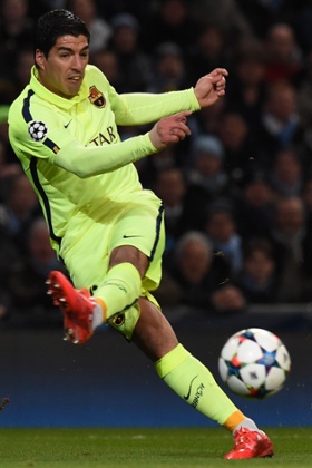 Luis Suarez shoots to score the opening goal.