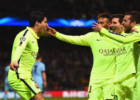 Luis Suarez celebrates scoring their second goal with team mates.
