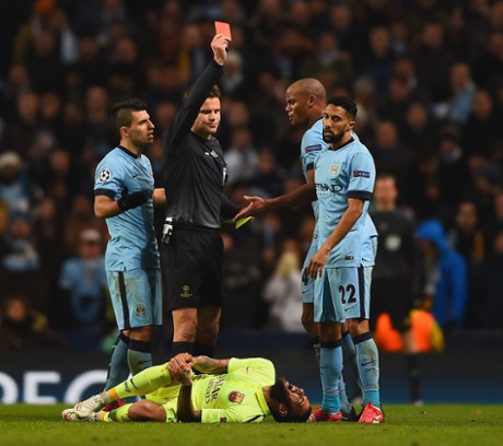 Vincent Kompany of Manchester City appeals as Referee Dr. Felix Brych shows Gael Clichy.