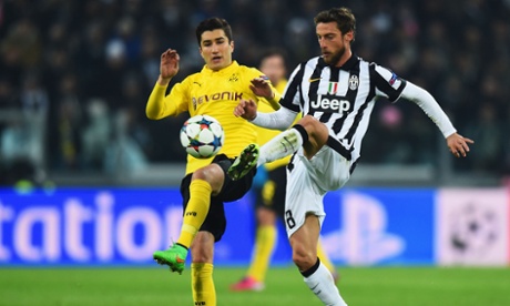 Nuri Sahin and Claudio Marchisio battle for the ball.