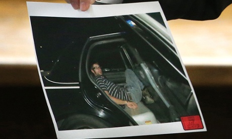 A photograph shown in court of Eddie Ray Routh handcuffed in the back of a Lancaster police car on the night of his arrest.